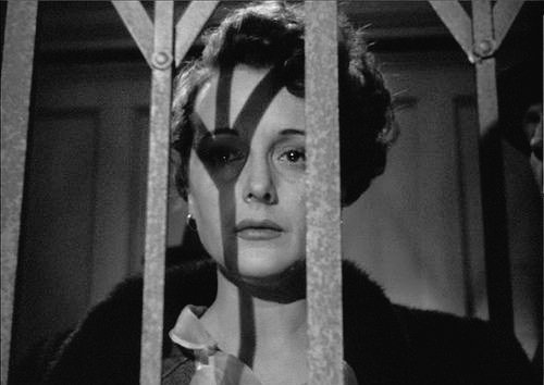 Symbolic shot of Mary Astor behind bars in The Maltese Falcon