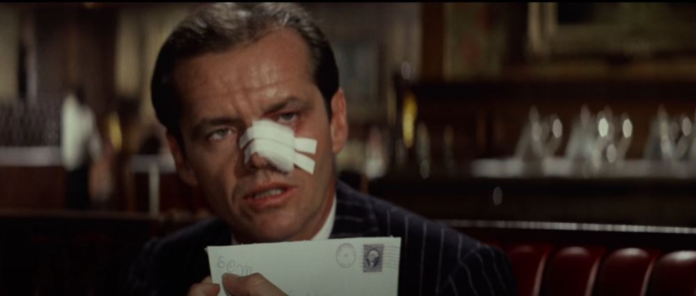 Jack Nicholson reveling the initial C on a letterhead in Chinatown