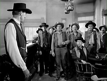 Towns people and Kane in the saloon in High Noon